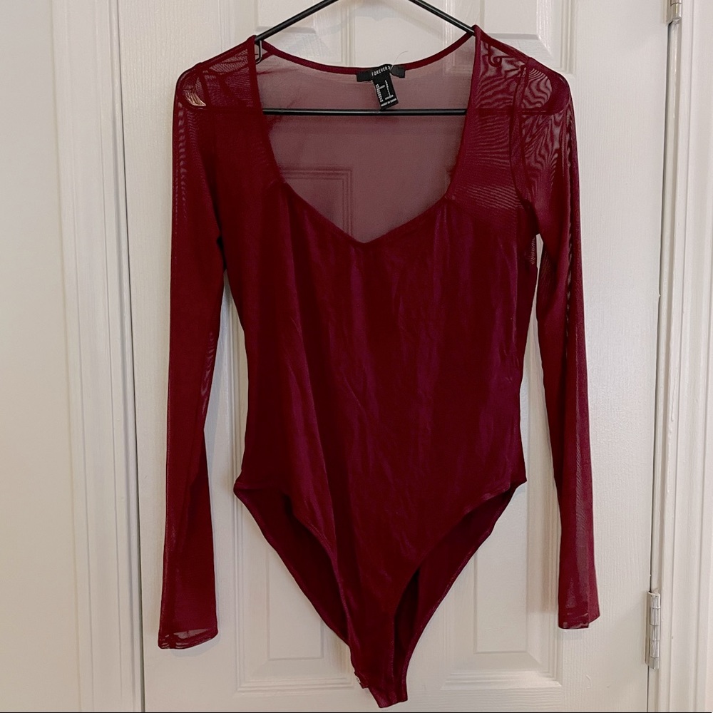 Maroon, long-sleeved partially sheers bodysuit.
